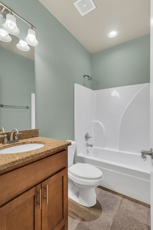 full bathroom featuring tile patterned floors, vanity,  shower combination, and toilet