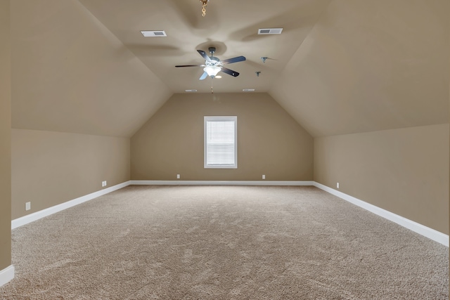 bonus room with ceiling fan, carpet floors, and vaulted ceiling