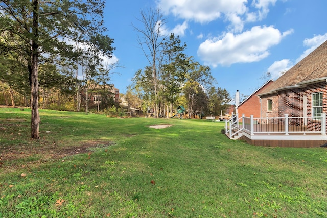 view of yard with a wooden deck