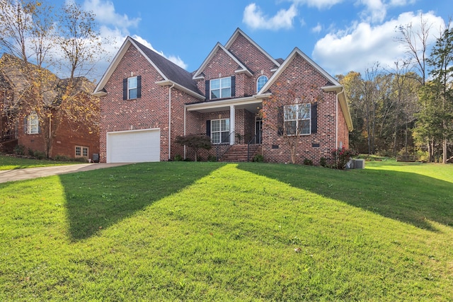 front of property featuring central AC, a front yard, and a garage