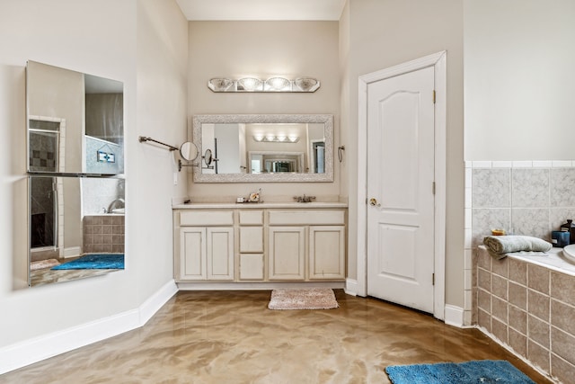 bathroom featuring plus walk in shower and vanity