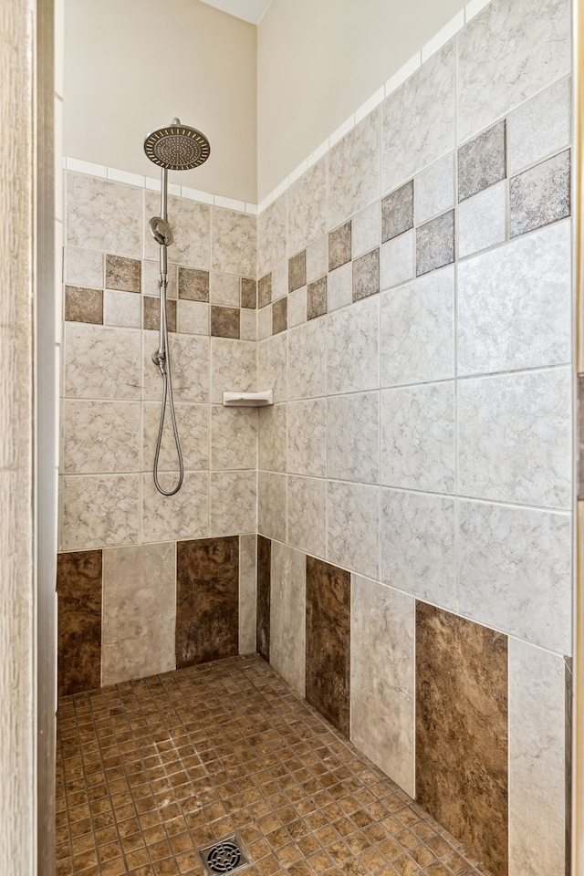 bathroom with tiled shower