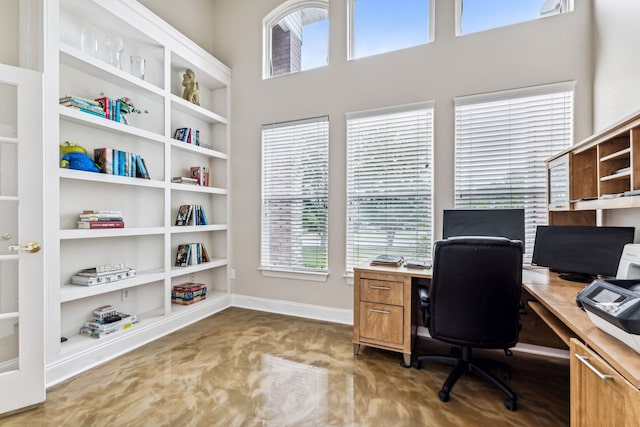 office featuring a wealth of natural light and a high ceiling