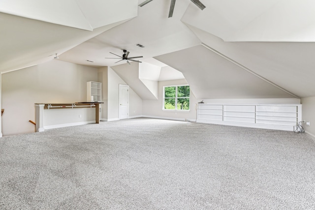 bonus room featuring ceiling fan, carpet floors, and vaulted ceiling