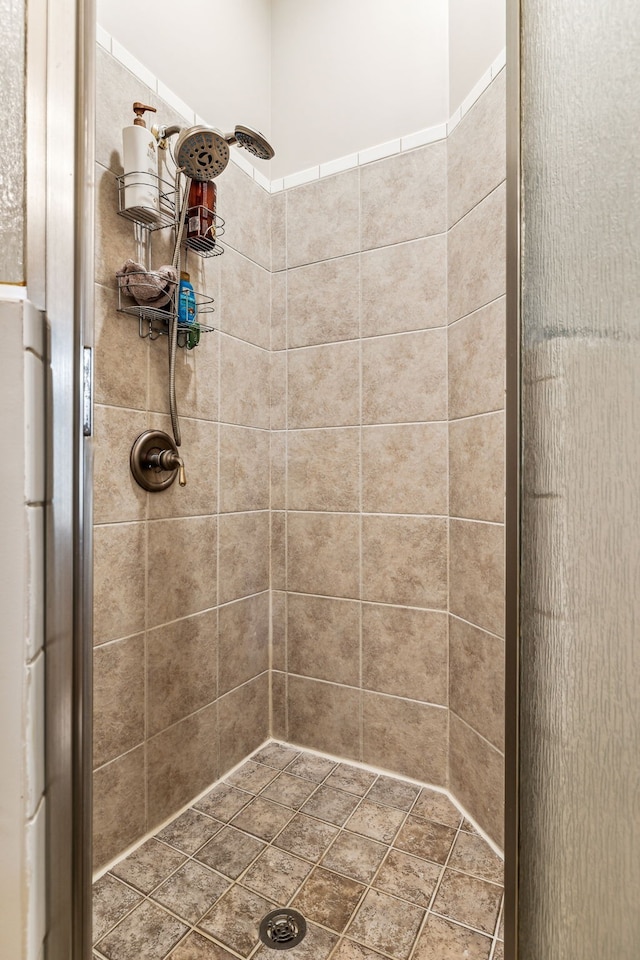 bathroom with tiled shower