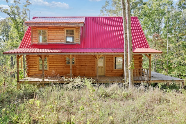 log home with covered porch