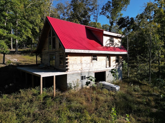 view of home's exterior with a wooden deck