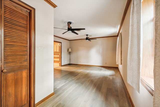 unfurnished living room with ceiling fan, light hardwood / wood-style floors, and ornamental molding