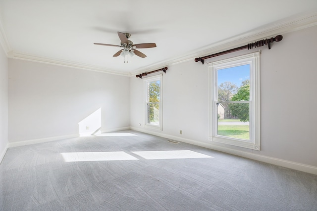 carpeted empty room featuring ceiling fan and ornamental molding