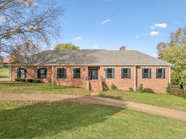 single story home with a front lawn