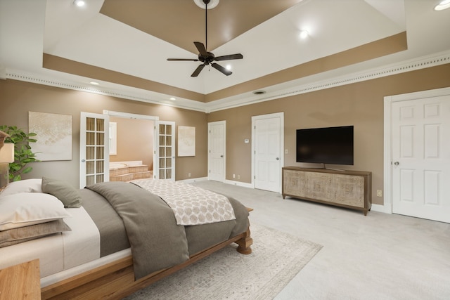 bedroom featuring a tray ceiling, ceiling fan, french doors, and carpet