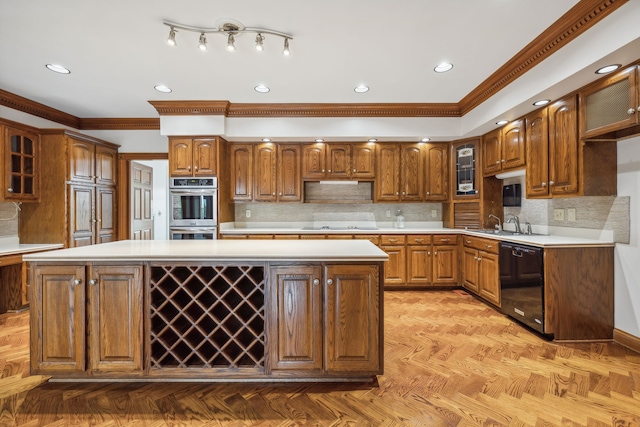 kitchen featuring crown molding, black dishwasher, double oven, tasteful backsplash, and a kitchen island