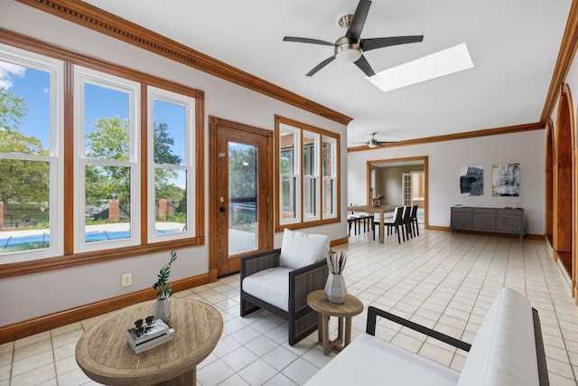 interior space featuring ceiling fan and a skylight