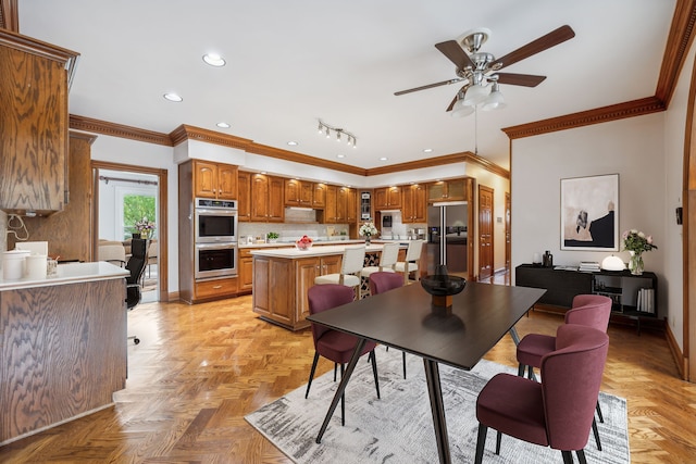 dining room featuring ceiling fan, light parquet floors, and ornamental molding