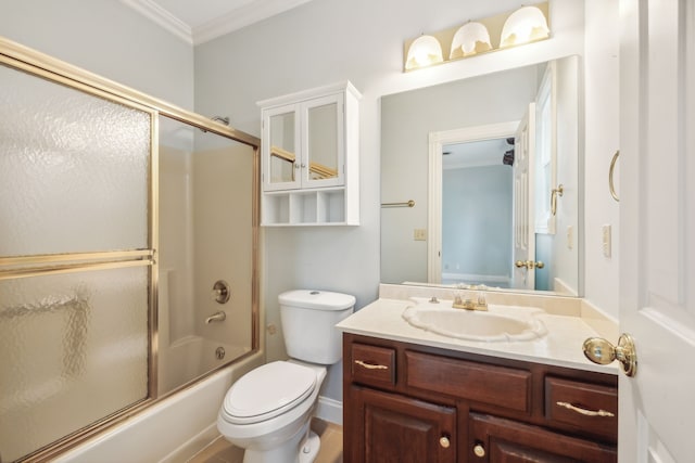 full bathroom with crown molding, toilet, vanity, and combined bath / shower with glass door