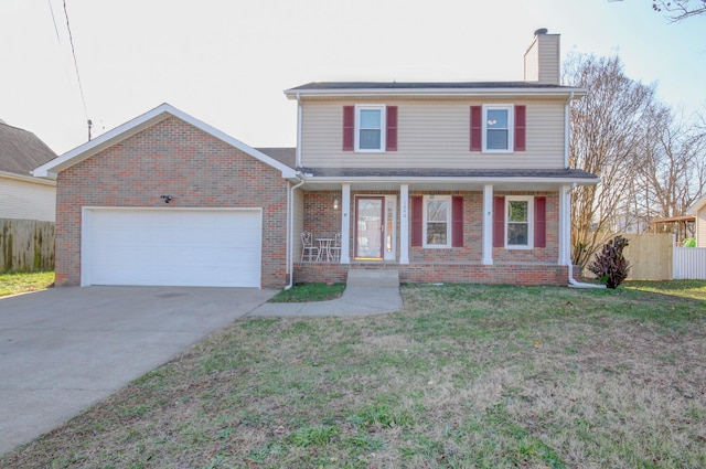 view of front property with a front yard and a garage