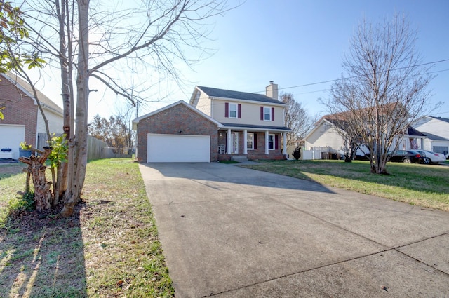 view of front of property with a front lawn and a garage