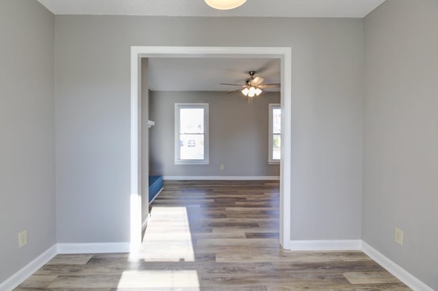 spare room with wood-type flooring and ceiling fan