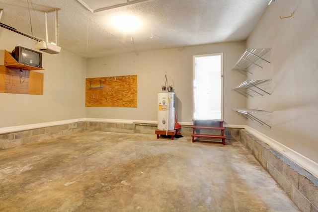 garage featuring a garage door opener and water heater