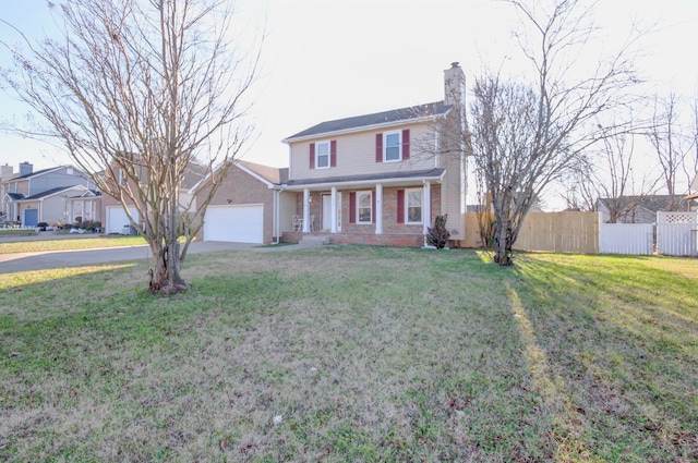 front of property featuring a front yard and a garage