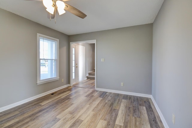 spare room with ceiling fan and light hardwood / wood-style flooring