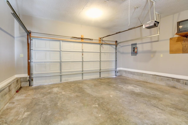 garage featuring electric panel and a garage door opener