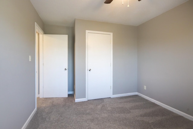 unfurnished bedroom with carpet and ceiling fan