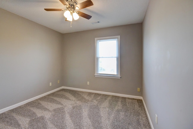 empty room with carpet and ceiling fan