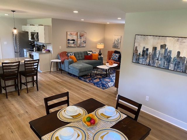 dining room featuring light hardwood / wood-style floors