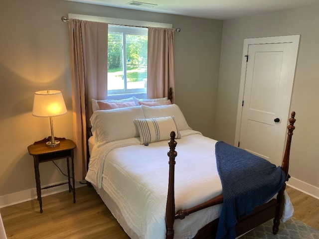 bedroom with wood-type flooring