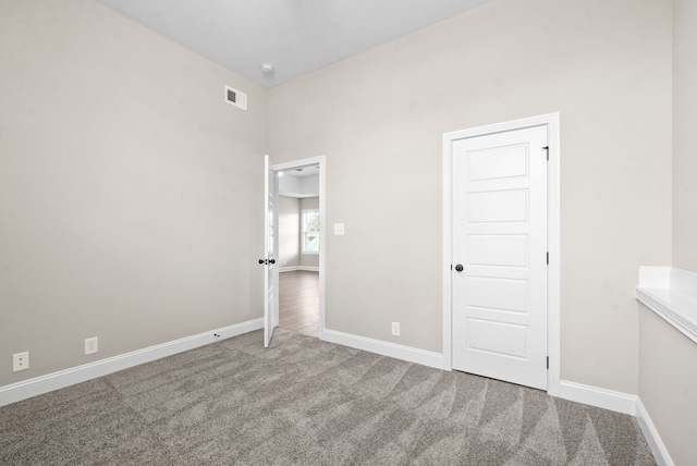 unfurnished bedroom with carpet floors