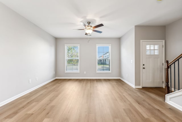 entryway with light hardwood / wood-style floors, a wealth of natural light, and ceiling fan