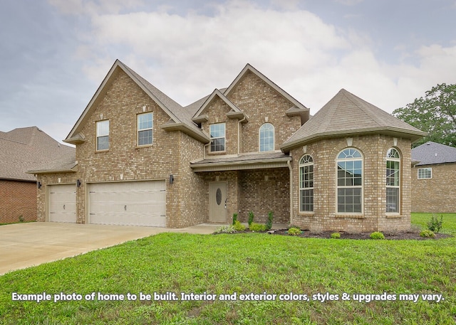 view of front of property with a garage and a front yard