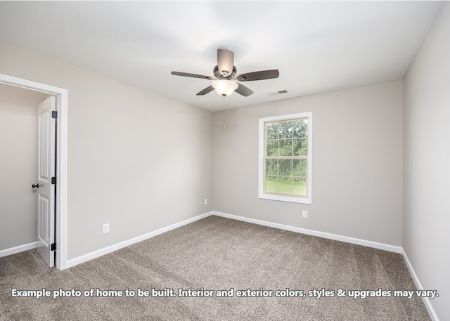 carpeted spare room with ceiling fan