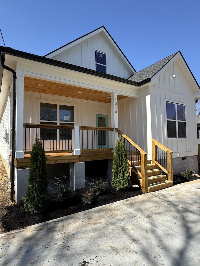 view of front of home featuring board and batten siding, crawl space, covered porch, and a shingled roof