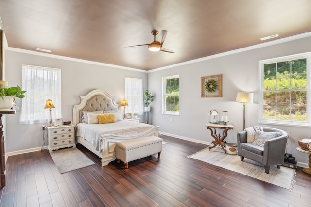 bedroom featuring ornamental molding, dark wood-type flooring, and ceiling fan