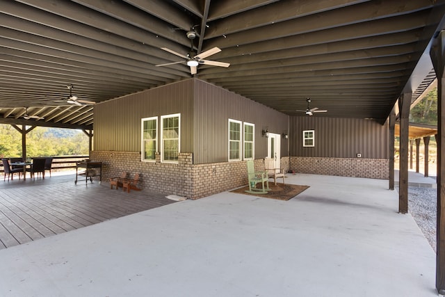 exterior space with ceiling fan and a wooden deck