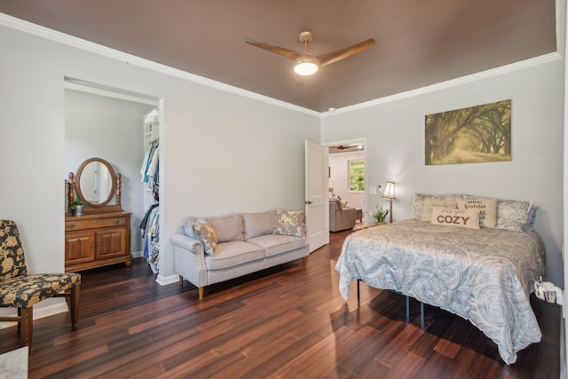 bedroom featuring ornamental molding, ceiling fan, and dark hardwood / wood-style flooring