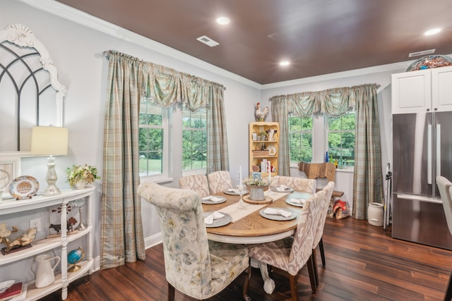 dining room featuring crown molding and dark hardwood / wood-style flooring