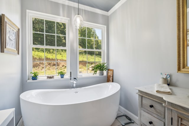 bathroom with tile patterned flooring, a washtub, and crown molding