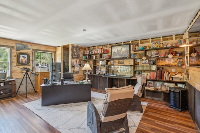 office space featuring wood walls and hardwood / wood-style flooring