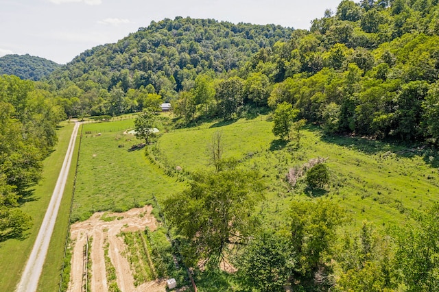 birds eye view of property with a rural view