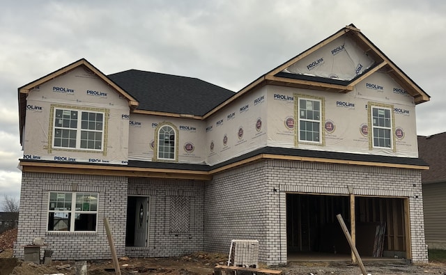 unfinished property featuring a garage