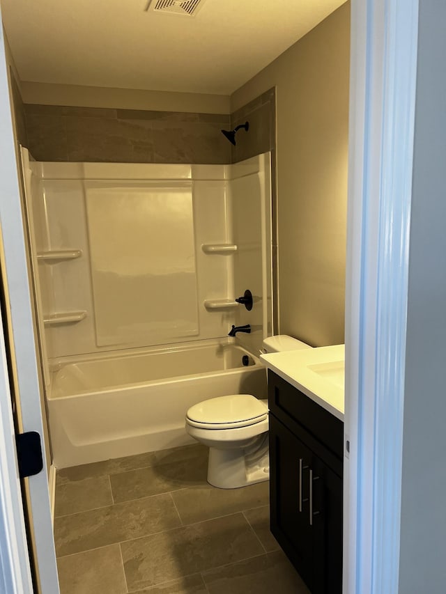 full bath featuring visible vents, bathing tub / shower combination, vanity, and toilet