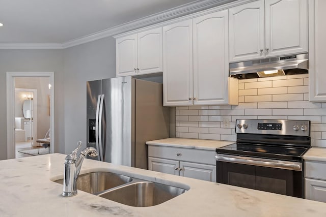 kitchen with white cabinets, appliances with stainless steel finishes, tasteful backsplash, and sink