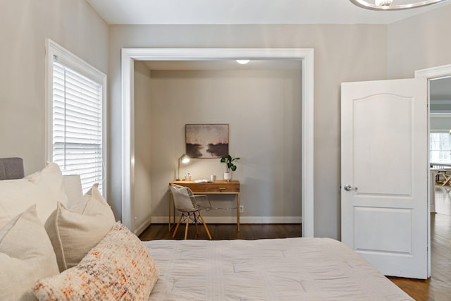 bedroom with wood-type flooring