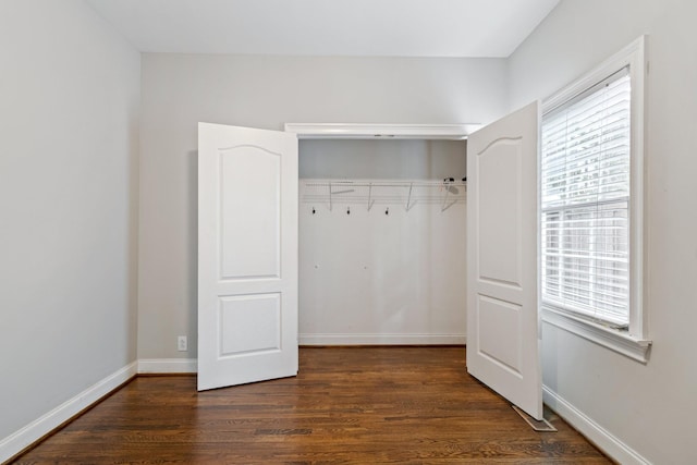 interior space featuring a closet and dark hardwood / wood-style flooring