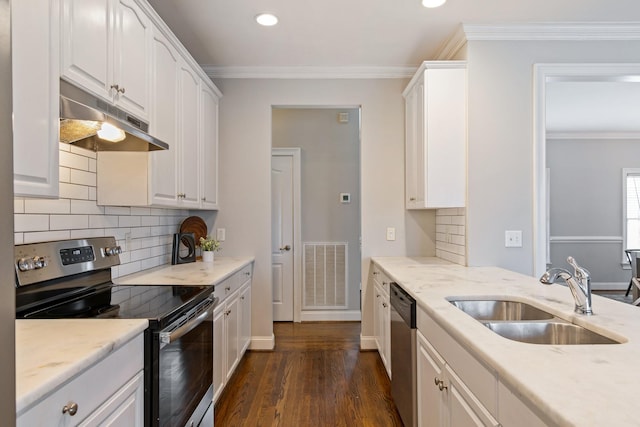 kitchen featuring sink, dark hardwood / wood-style flooring, crown molding, white cabinets, and appliances with stainless steel finishes