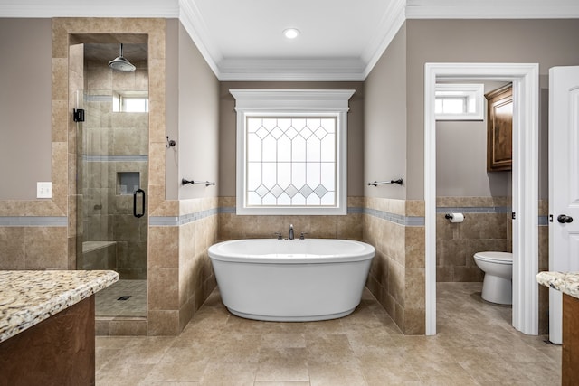 bathroom with separate shower and tub, toilet, tile walls, and crown molding