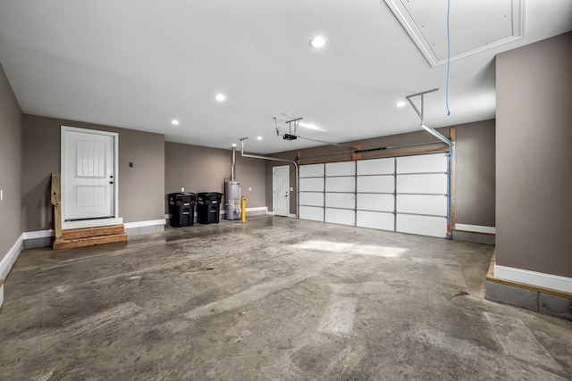 garage with a garage door opener and water heater